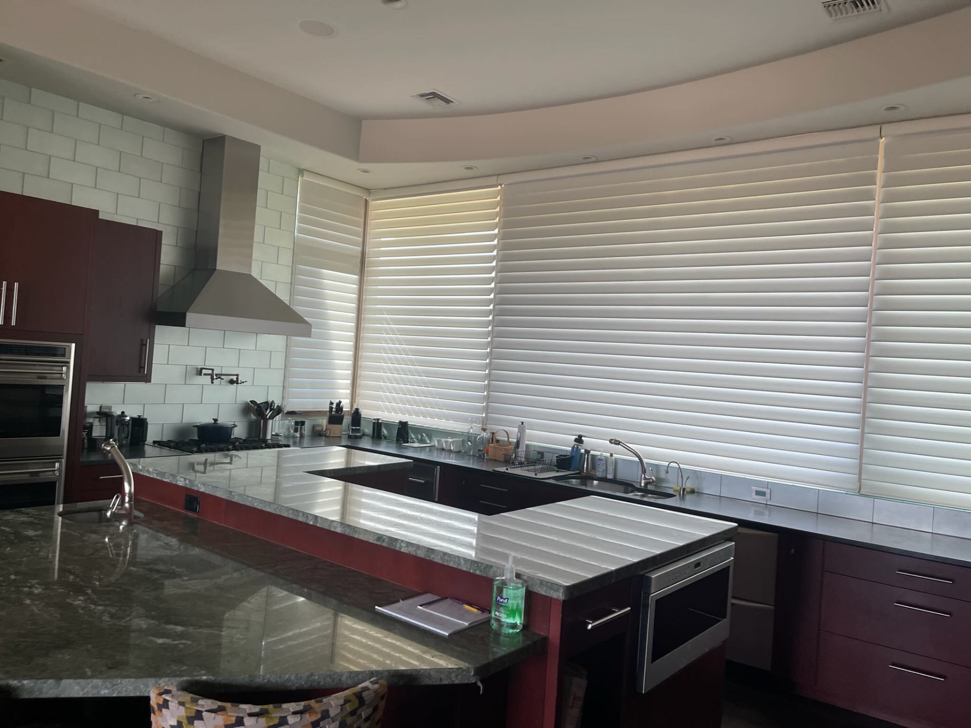 Spotless gourmet kitchen with stone counters